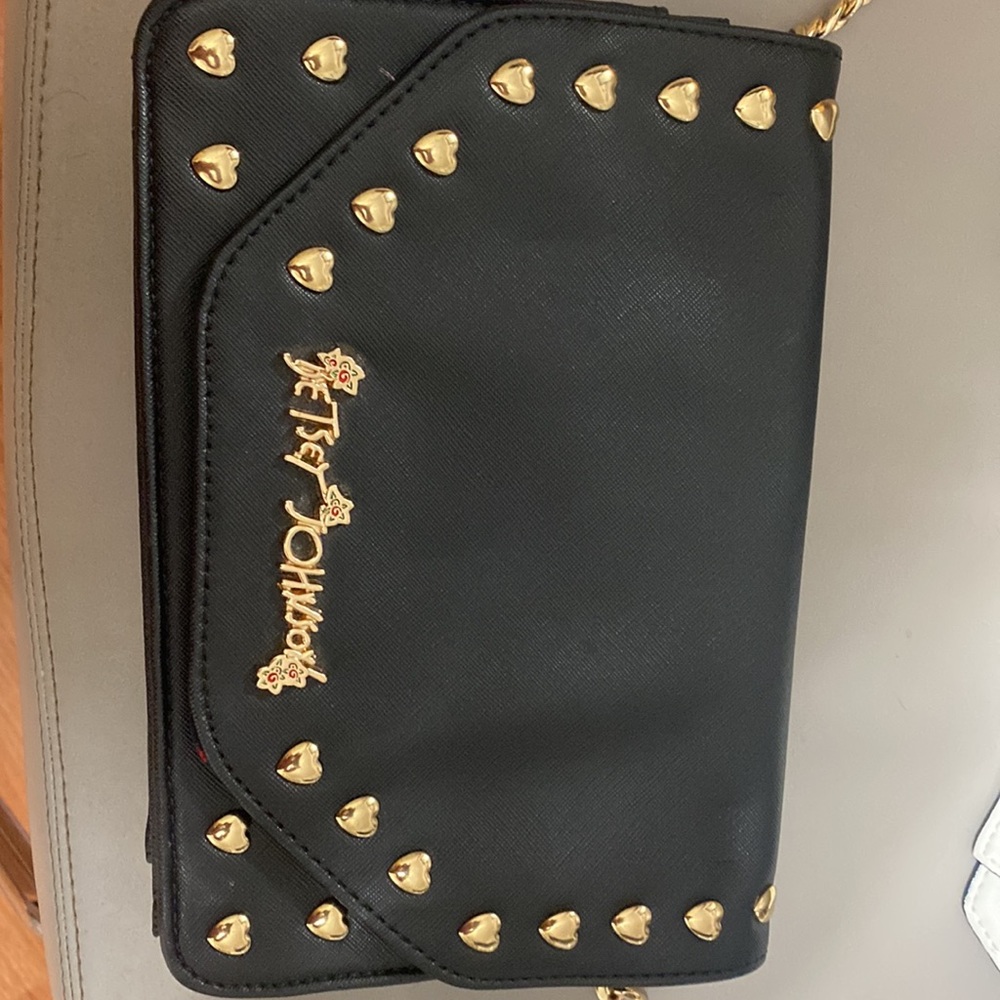 Betsy Johnson Black Handbag with hearts.Gold lettering, with White bow.